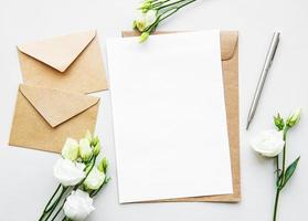 White eustoma flowers and envelopes photo