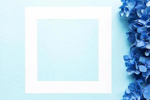 White frame and blue hydrangea flowers photo