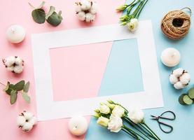 White frame and cotton flowers photo