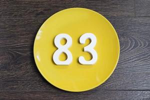 The number eighty-three on the yellow plate. photo