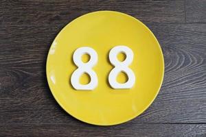 The number eighty-eight on the yellow plate. photo