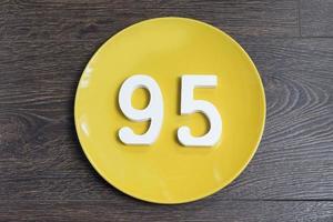 The number ninety-five on the yellow plate. photo