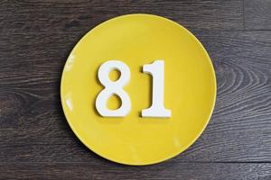 The number eighty-one on the yellow plate. photo