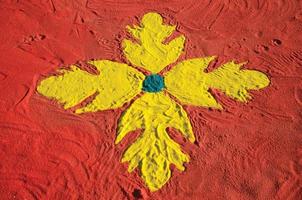 Sao Manuel, Brazil - May 31, 2018. Handmade drawing on colorful sand carpet made by the devotees for the celebration of Holy Week in Sao Manuel. A little town in the countryside of Sao Paulo State. photo