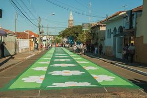 Sao Manuel, Brazil - May 31, 2018. Artistic colorful sand carpet made by the devotees for the celebration of Holy Week on the street of Sao Manuel. A little town in the countryside of Sao Paulo State. photo