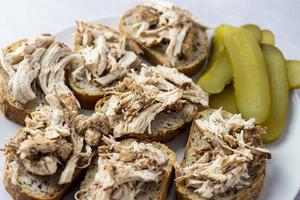 Sandwiches with chicken and pickled cucumber. photo