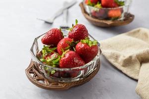 Strawberries in vintage bowls. A delicious summer snack. photo
