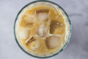 Iced coffee with pieces of ice. Top view. photo