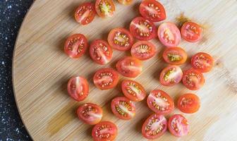 Cherry tomatoes cut in half. View from above. photo