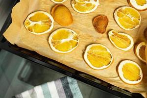 Dried orange slices. Preparation of holiday decorations. photo