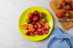 Fresh strawberries on a plate. Top view. photo