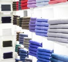 Polo t-shirt store interior. Shop shelves with  colored fashion cotton shirt photo