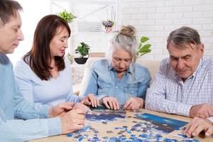 Family completing jigsaw together at home with puzzle