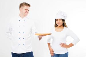 team of chefs posing on a white background with an empty pizza board photo