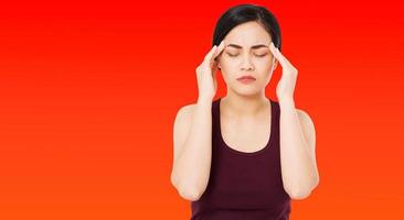 korean,chinese woman's headache severely, suffering asian woman,girl isolated on red background