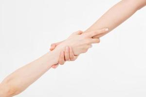 Two hands isolated. Helping hand to a friend. Copy space. Rescue or helping gesture of arms. photo