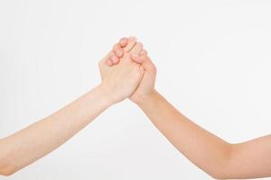Two hands isolated. Helping hand to a friend. Copy space. Rescue or helping gesture of arms. Abstract confrontation photo