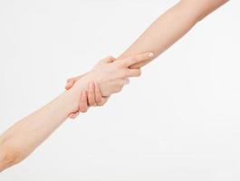 Two hands isolated. Helping hand to a friend. Copy space. Rescue or helping gesture of arms. photo