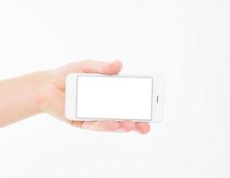 Hand holding white phone isolated on white clipping path inside. Top view.Mock up.Copy space.Template.Blank. photo