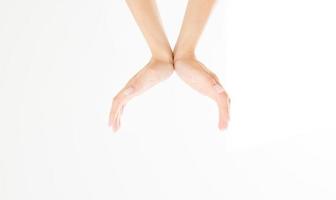 female hands measuring invisible items, woman's palm making gesture while showing small amount of something on white isolated background, side view, close-up, cutout, copy space photo