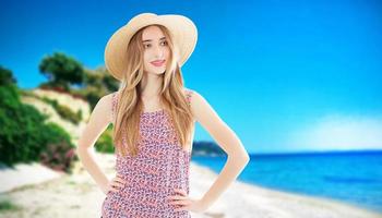 Happy woman with summer hat at the beach enjoying her summer holidays in the beach tropical background in maldives vacation. photo