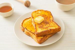 French toasted with butter and honey photo