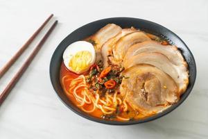 Ramen Noodles Spicy Tomyum Soup with Roast Pork photo