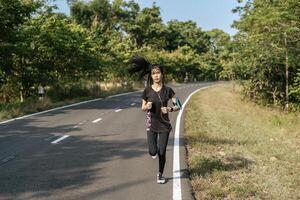 women exercise by running on the road. photo