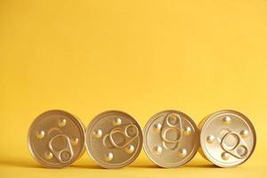 Canned food closed on yellow background photo