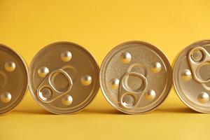 Canned food closed on yellow background photo