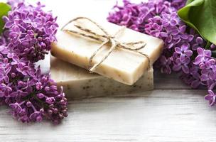 Natural soap and lilac flowers photo