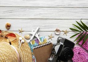 Traveler accessories on wooden  background photo