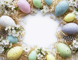 Colorful Easter eggs with spring blossom flowers photo