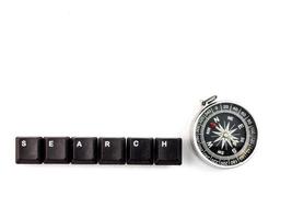 Compass and SEARCH Splatter blackkeyboards botton the White background. photo
