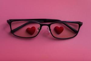 Hearts in glasses on a pink background. photo