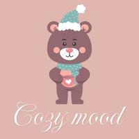 Cute teddy bear in a scarf and hat holding a mug with a heart. Cozy mood text. vector