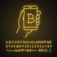 Bitcoin digital wallet neon light icon. E-payment. Cryptocurrency. Glowing sign with alphabet, numbers and symbols. Hand holding smartphone with bitcoin sign. Vector isolated illustration