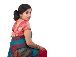 Beautiful young girl posing in Indian traditional saree on white background. photo