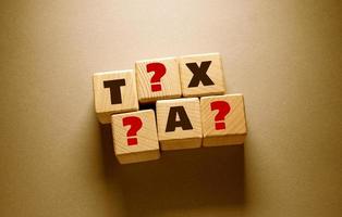 Tax Word with Wooden Cubes photo