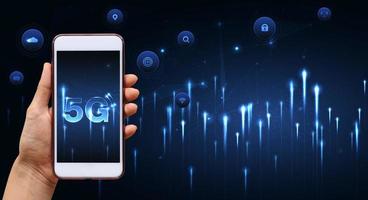 Hand of woman or man holding smartphone use 5G network wireless systems and internet of things with man touching with wireless high-speed Internet communication network background photo