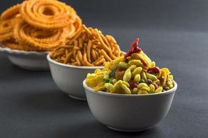 Indian Snack Chakli, chakali or Murukku and Besan Gram flour Sev and chivada or chiwada. Diwali Food photo