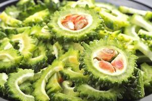 slice of Bitter melon or bitter gourd. Close up of sliced Bitter melon or bitter gourd photo