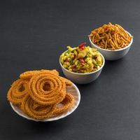 Indian Snack Chakli, chakali or Murukku and Besan Gram flour Sev and chivada or chiwada. Diwali Food photo