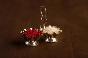 Kumkum and rice grain container. Natural color powders are used while worshipping God and an at auspicious occasions. photo