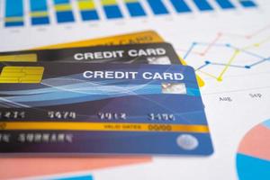 Credit card on chart and graph paper. Finance development, Banking Account, Statistics, Investment Analytic research data economy, Stock exchange trading, Business company concept. photo