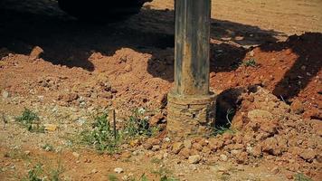 Tractor with a drilling device at a construction site video