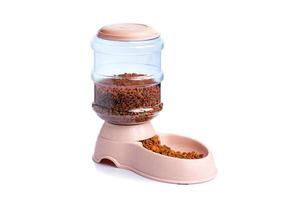 Pet Dry Food Storage Meal Feeder Dispenser or pet food dispenser on a white background photo