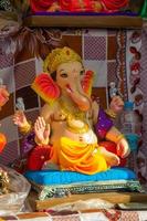 Statue of Hindu God Ganesha. close up of Ganesha Idol at an artist's workshop during Ganesha Festival. photo