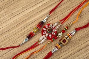 Raksha Bandhan background with an elegant Rakhi . A traditional Indian wrist band which is a symbol of love between Brothers and Sisters. photo