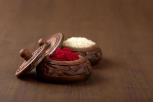 Kumkum and rice grain container. Natural color powders are used while worshipping God and an at auspicious occasions. photo